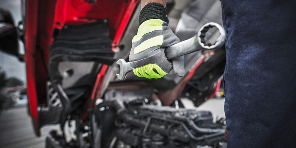 Photo of mechanic holding a wrench